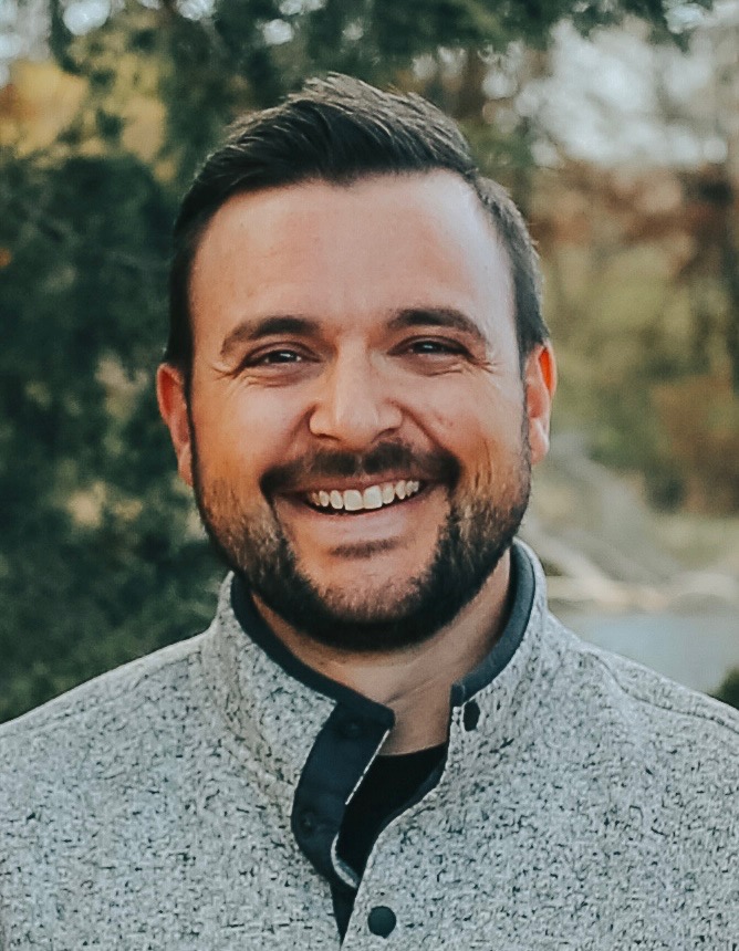 Male with a beard smiling